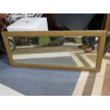 Large Bevelled Glass mirror with wall fixing lugs and attractive carved gilt frame. Measures 24 x 56