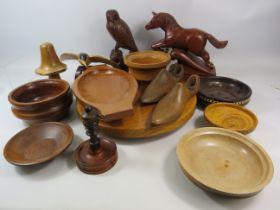 Mixed wooden ware lot including carved figures a rotating cake plate and a pair of vintage shoe