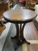 Heavily Contructed circular occasional table with attractive curved legs. 30 inches tall by 23 inch