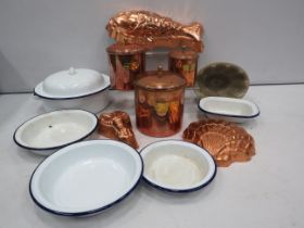 Various vintage enamel kitchen dishes, copper storage jars and jelly moulds.