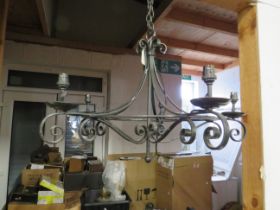 Wrought metal Ceiling chandelier which measures approx 19 inches drop by 26 inches in spread. See p