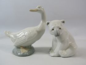 Lladro Polar Bear and Nao Goose figurines.