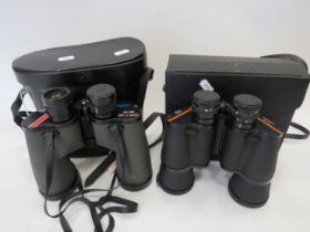 Two pairs of 10 x 50 Binoculars by Prinz & Swift, both come with hard carry cases. See photos.