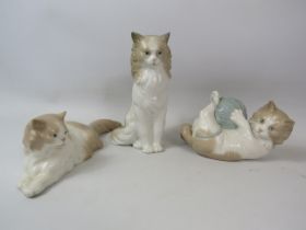 3 Nao Cat figurines.