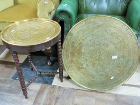 Bobbin turned small table with hammered brass top along with a large middle eastern brass charger. S