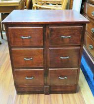 Chest of six short drawers heavily constructed in Oak. Raised on a plinth base it measures H:29 x W: