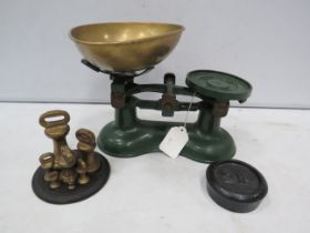 Pair of Cast iron Victor scales and a set of bell weights.