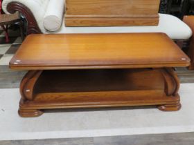 Pleasing and well made low table with shelf under made from oak. H:18 x W:51 x D:23 inches see photo