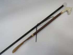 Ebonised wood walking cane with Crystal handle. Measures approx 35 inches long plus a long shoe horn