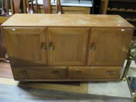 Mid Oak Cabinet with double cupboard doors to base with two shelves below. In sound condition but wo