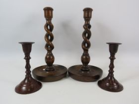 Pair of Oak twisted candle sticks 25cm tall plus a pair of bronzed candlesticks 14cm tall.