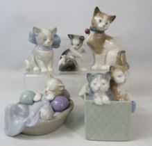 5 Nao and Lladro cat figurines.