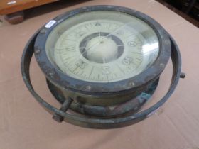 Brass Cased Ships Compass which has a brass Gimble Cradle and floats in liquid. Appears to be in wor