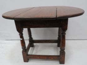 Small antique Oak drop leaf table with swivel top, 47cm high, the top measures 63cm by 47cm when