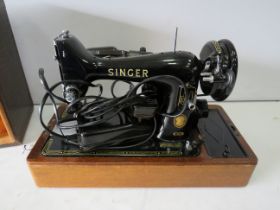 Singer 99k electric sewing machine with case.