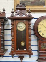 Oak Cased Wall Clock with enamel dial in working order. 38 inches long. See photos.