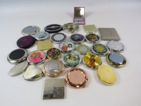 Large selection of various compacts and travel mirrors.
