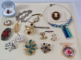 Selection of various vintage costume jewellery including a sterling silver coin bracelet and a