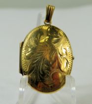 9ct Yellow Gold Locket with chased decoration. Measures approx 28 x 20 mm. Total weight 3.0g
