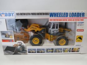 Hobby Wheeled Loader in 1:14 Scale with re-chargable battery and remote control. Believed to be comp