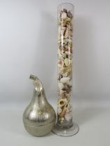 White metal pear storage jar plus a tall glass vase full of sea shells, 58cm tall.
