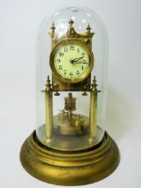 Brass made Anniversary clock with enamel face. No makers mark .  Appears to be in running order. Gla