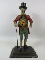 Novelty cast iron peddler clock in the form of a dandy dressed man,repair to neck and for spares