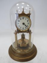 German Made Brass based Anniversary clock with enamel Dial. Sits under a Glass dome which measures a