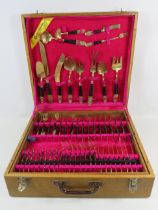 100 Piece URAI Thailand brass and ebony cutlery set in wooden case.