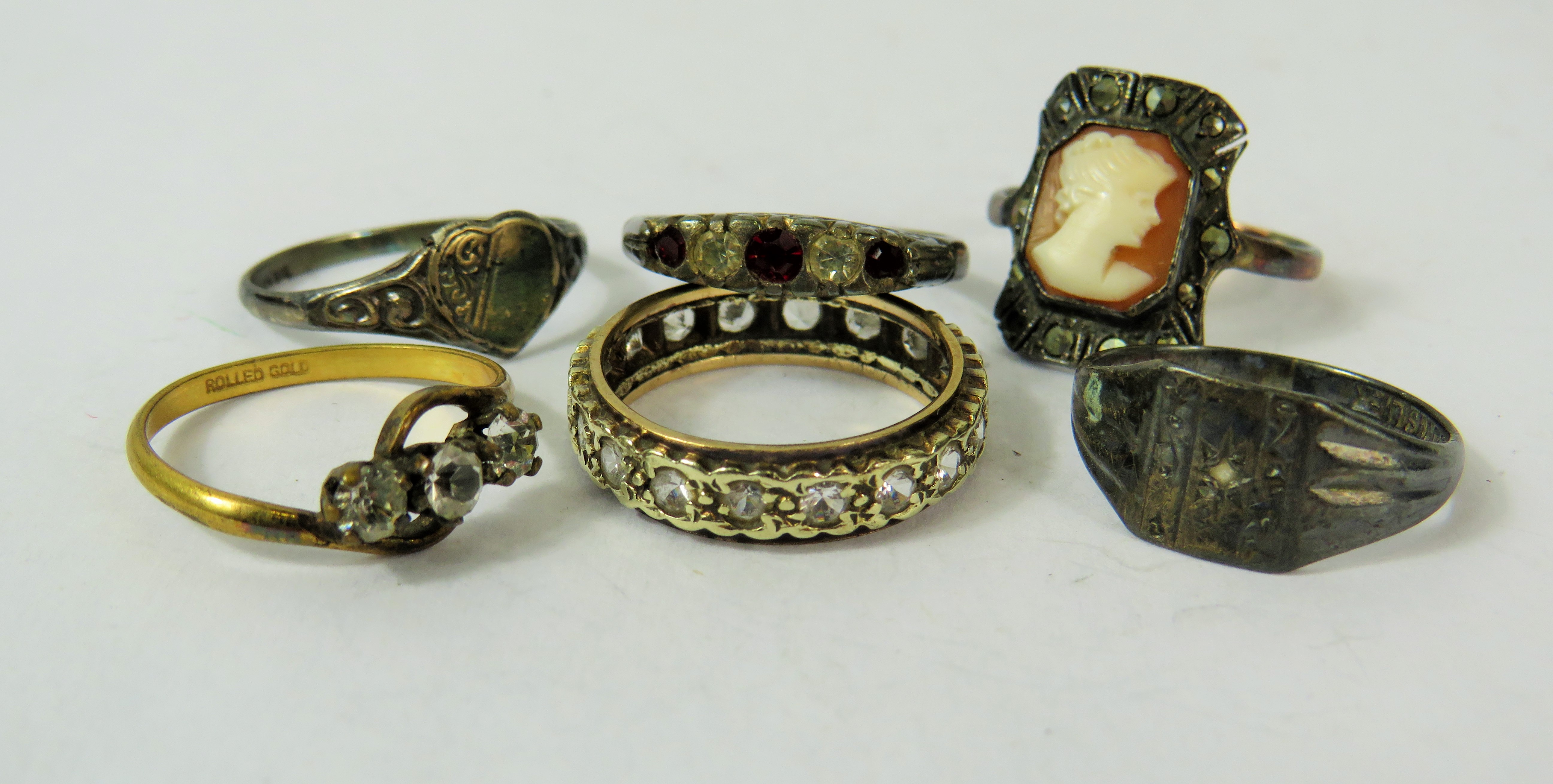 Selection of four Silver rings, one Rolled Gold Ring and one (unmarked) Gold Ring   See photos. 