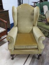 Edwardian Era Library wing chair raised on cabriole legs. Good Mustard coloured upholstery. See phot