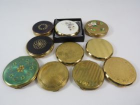 10 Gold tone compacts by Stratton, Kigu etc.