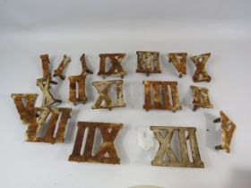 Antique cast iron Roman numeral golf markers.