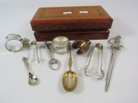 Wooden box and contents including a pair of art nouveau pincers, napkin rings etc.