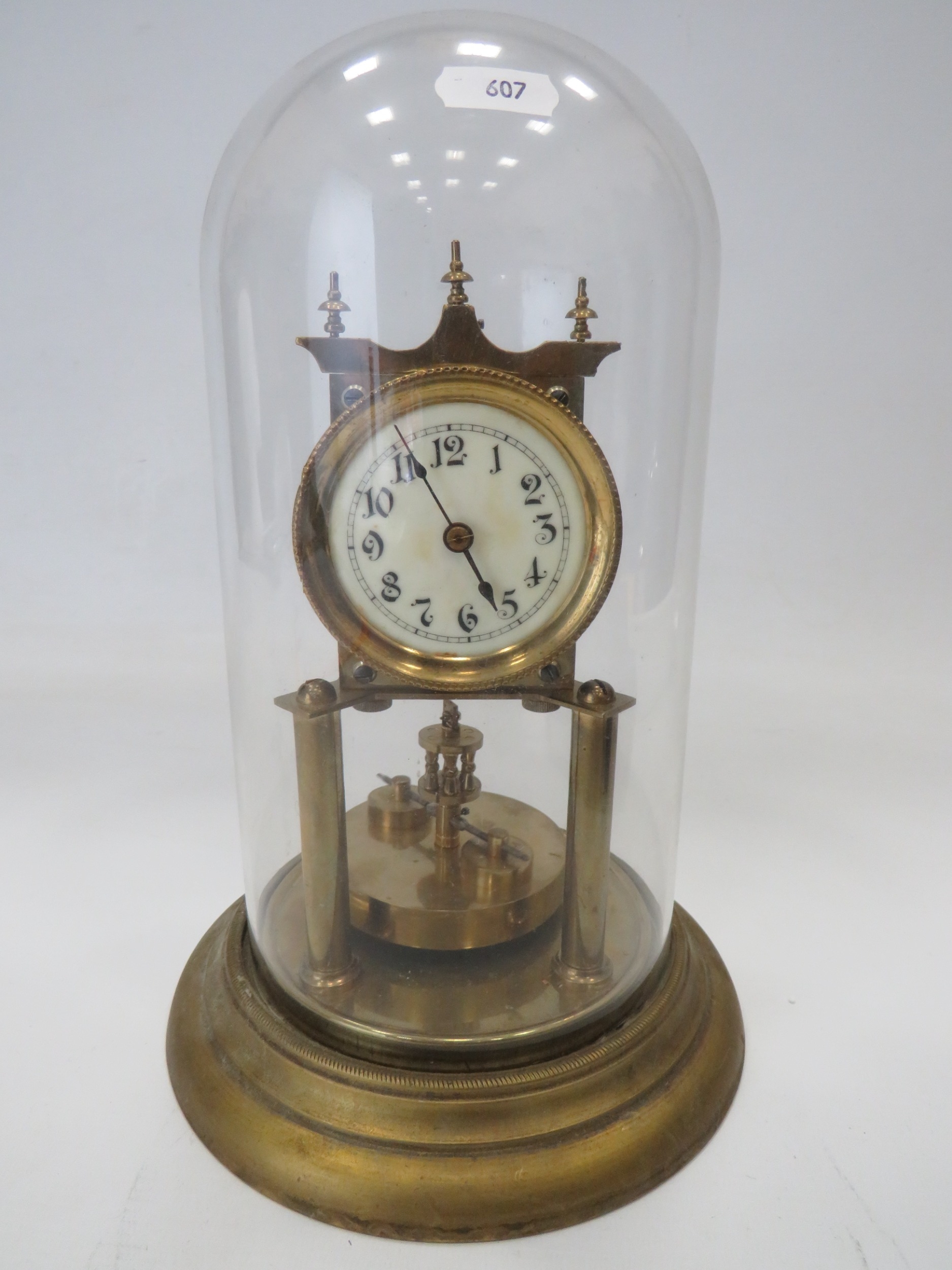 Brass Based Anniversary clock under a Glass Dome which measures approx 11 inches tall. Running order