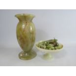 Large onyx vase and a pedastal bowl with a selection of fruit.