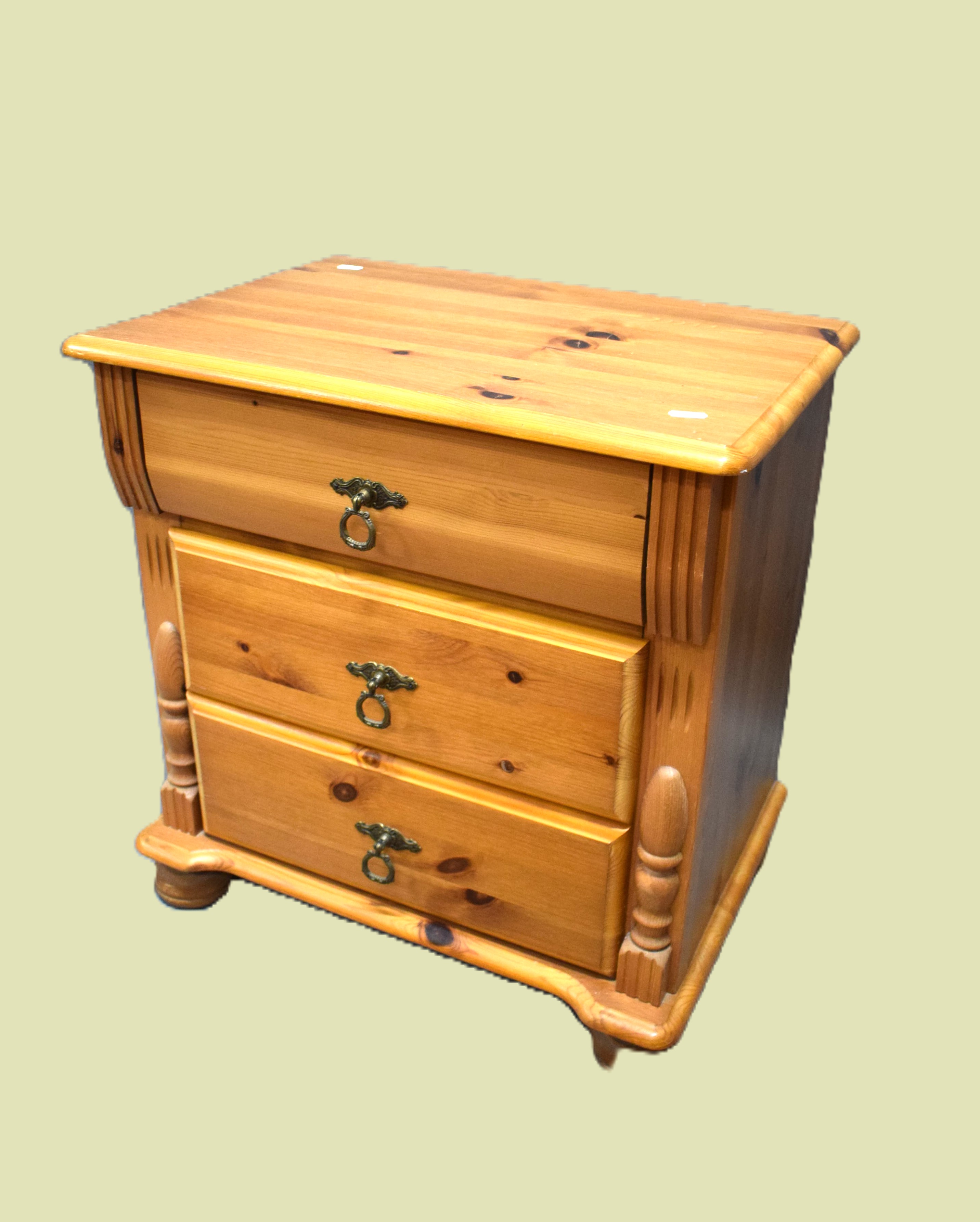 Three drawer pine table on bun feet with applied decorations.  H:23 x W:21 x D:15 inches. See photos - Image 2 of 2