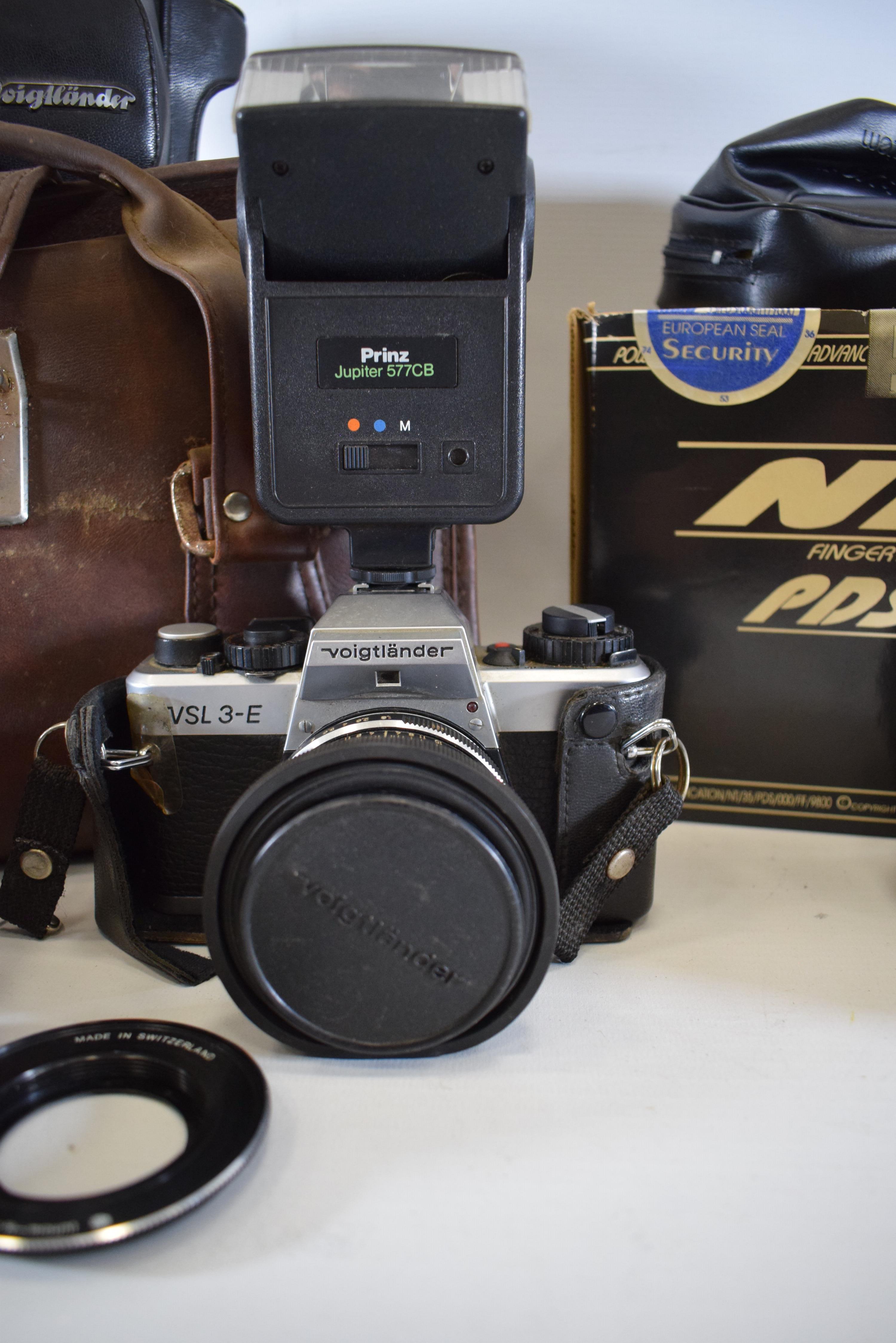 Nikai Auto power drive camera with flash plus a Voitlander VSL 35mm SLR camera plus accessories with - Image 2 of 3