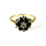9ct Yellow Gold Ring set with a small central Diamond with Sapphires and Diamonds in a flower patter