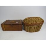 Vintage wooden sewing box and a wicker basket with contents.