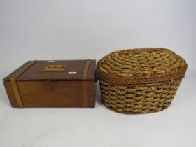 Vintage wooden sewing box and a wicker basket with contents.