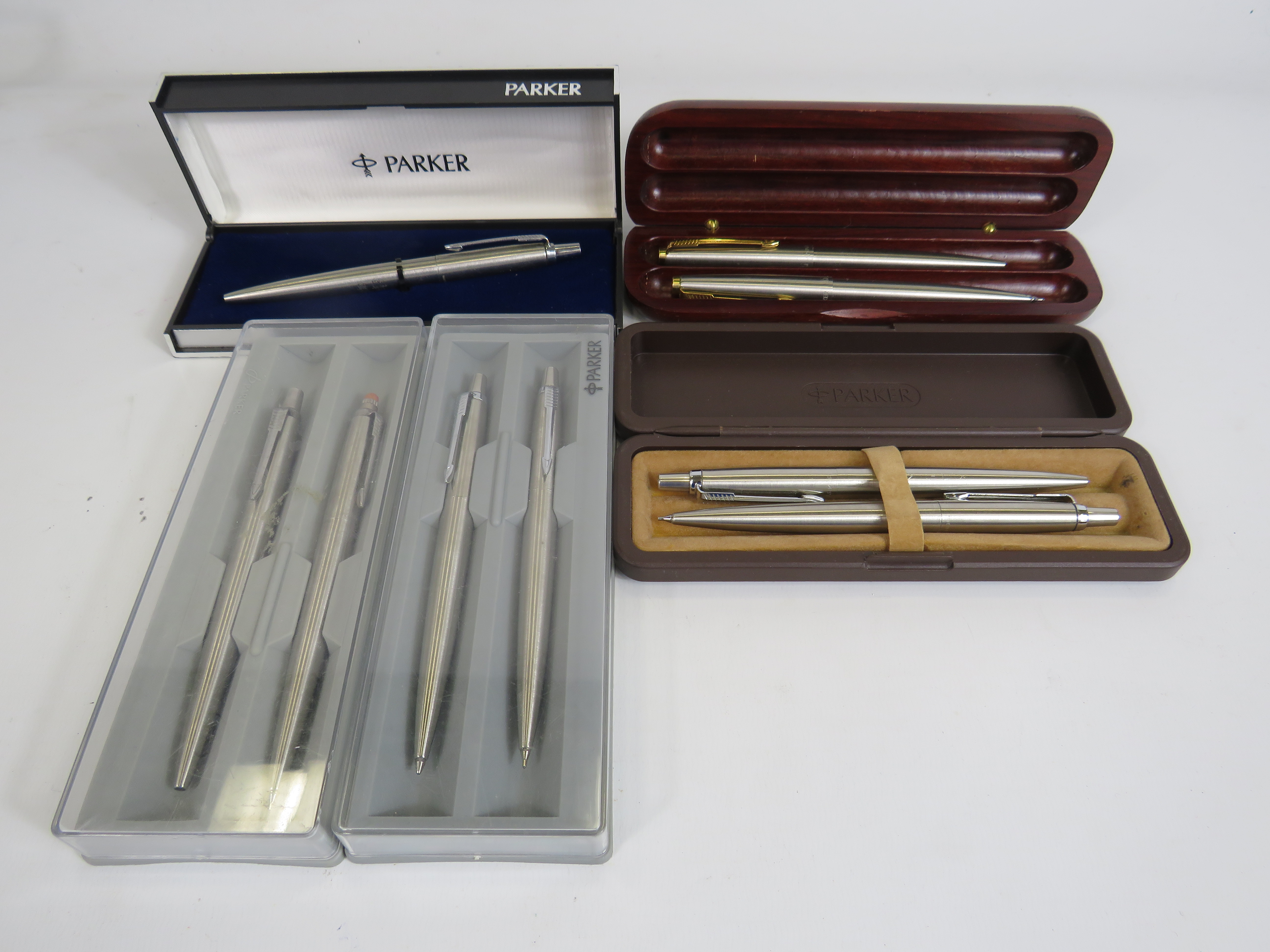 4 brushed metal Parke rballpoint pen and pencil sets plus one single pen all with boxes.