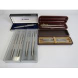 4 brushed metal Parke rballpoint pen and pencil sets plus one single pen all with boxes.