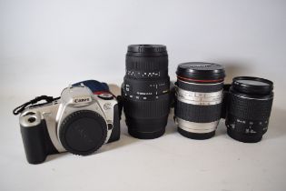 Canon Eos 300 35mm Camera Body with a Canon Zoom lens EF 28-90mm. Sigma DG for Canon lens 70-300mm.