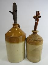 Two vintage stoneware ale bottles with wooden taps. The tallest been 13". See pics for condition.