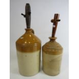 Two vintage stoneware ale bottles with wooden taps. The tallest been 13". See pics for condition.