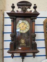 Vintage  wal lclock with Metal and enamel face. Running order with Key. See photos. 