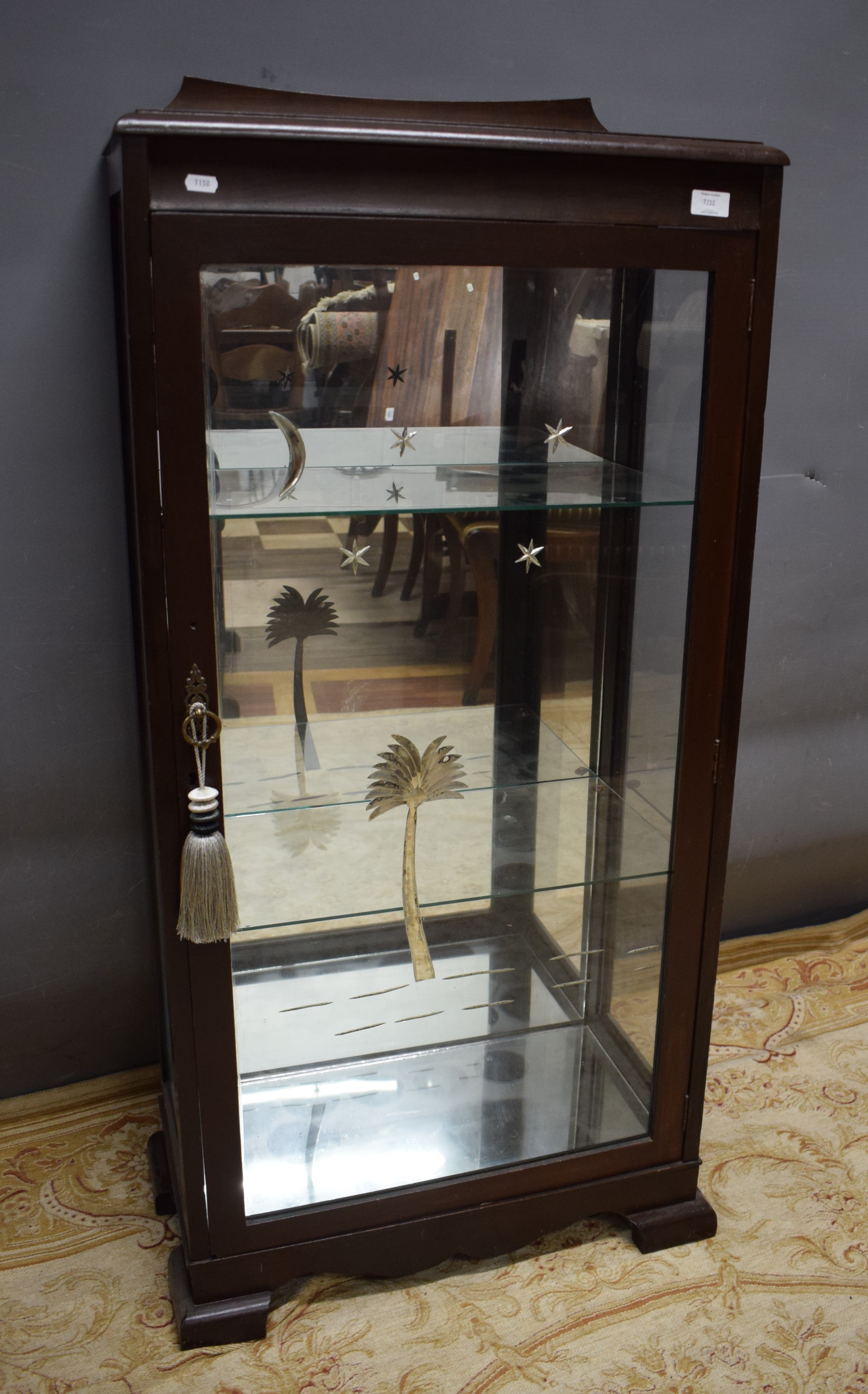 Mirror backed Glass display cabinet with etched palm trees and stars to the single door. Glass