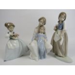 3 Nao figurines, 2 of Girls with flowers and 1 of a mother and child, the tallest measures 23cm (