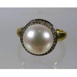 9ct Yellow Gold Ring set with a 10mm Pearl with Diamond Surround.  Finger size 'N-5'    3.5g